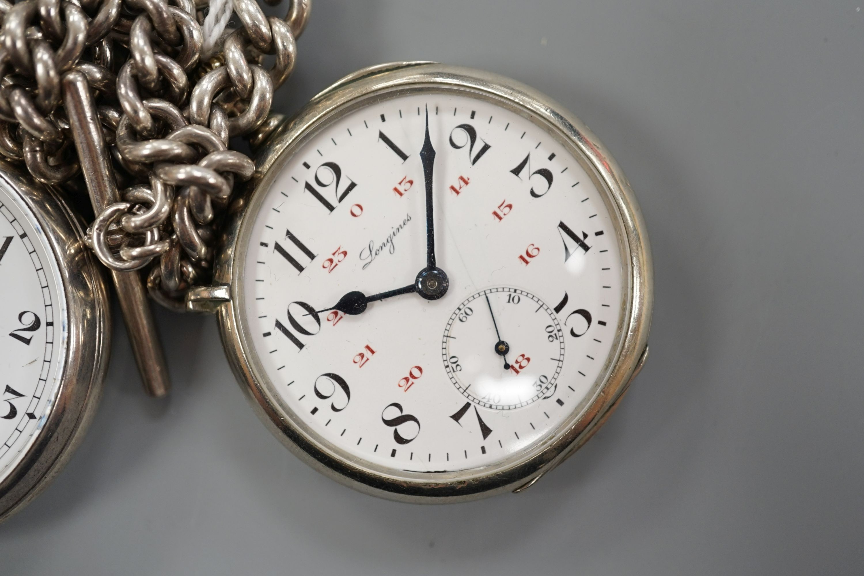 A 1930's silver open face pocket watch by Kendal & Dent and a chrome cased Longines pocket watch, both with alberts, one hallmarked silver.